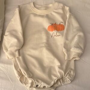Cream Baby Onesie with Pumpkin Design